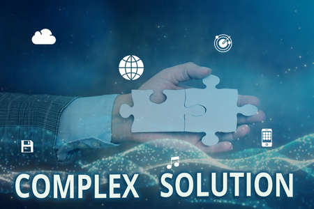 Text caption presenting Complex Solution. Business idea significant ideas that are completely or partly repressed Hand Holding Jigsaw Puzzle Piece Unlocking New Futuristic Technologies.の写真素材