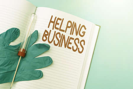 Sign displaying Helping Business. Business concept improving some measure of an enterprise s is success Writing Important Medical Notes Laboratory Testing Of New Virus Medicineの写真素材