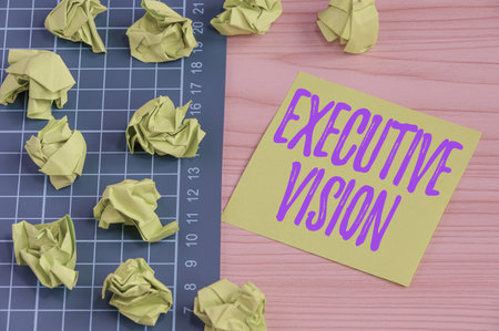 Sign displaying Executive Vision. Business approach inspires those around them to move toward Creates solution Multiple Assorted Collection Office Stationery Photo Placed Over Tableの写真素材