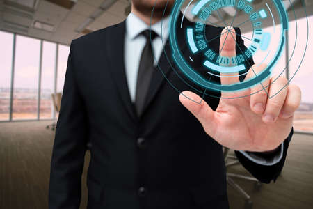 Man In Office Uniform Standing Pressing Virtual Button With Finger Holding Tablet. Gentleman In Business Attire Carrying Tab Pointing New Futuristic Technology.の写真素材