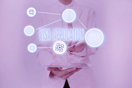 Conceptual display Visa Application. Business approach an process of getting an entry permit to a foreign land Lady Holding Tablet Pressing On Virtual Button Showing Futuristic Tech.の写真素材
