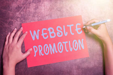 Hand writing sign Website Promotion. Word Written on increase exposure of a website to bring more visitors Writing Important Notes Brainstorming New Design And Inspirationの写真素材