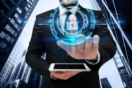 Man In Uniform Standing Holding Tablet And Virtually Tapping Screen. Business Man Carrying Pad...