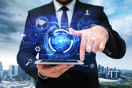 Man In Uniform Standing Holding Tablet And Virtually Tapping Screen. Business Man Carrying Pad...