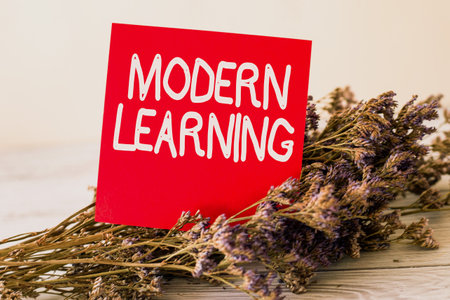 Inspiration showing sign Modern Learning. Internet Concept flexible and agile setup Innovative learning environments Blank Piece Of Sticky Note Placed On Top Of A Table Beside A Plant.の写真素材