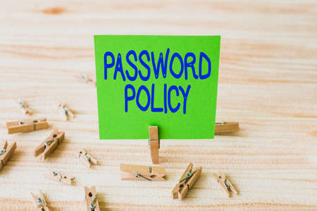 Text sign showing Password Policy. Business approach first line of protection against any unauthorized access Piece Of Blank Square Note Surrounded By Laundry Clips Showing New Idea.の写真素材