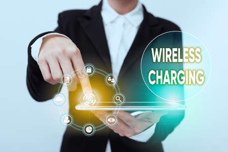 Text caption presenting Wireless Charging. Concept meaning methods of charging batteries without the...