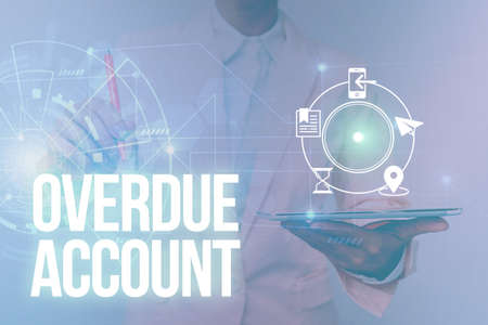 Writing displaying text Overdue Account. Internet Concept loans and other obligations remaining unpaid past their due Woman In Uniform Standing Holding Tablet Showing Futuristic Interface.の写真素材