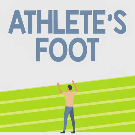 Conceptual caption Athlete S Is Foot. Business approach a fungus infection of the foot marked by blisters Athletic Man Standing On Track Field Raising Both Hand Showing Celebration.の写真素材