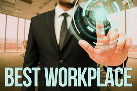 Sign displaying Best Workplace. Business idea helps employees to grow individually Promotes meritocracy Man In Office Uniform Standing Pressing Virtual Button Holding Tablet.の写真素材