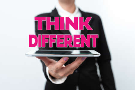 Text sign showing Think Different. Business showcase unusual method or practice that showing use to think Presenting New Technology Ideas Discussing Technological Improvementの写真素材