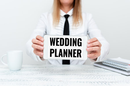Handwriting text Wedding Planner. Business idea someone who plans and organizes weddings as a profession App Developer Presenting New Program, Displaying Upgraded Deviceの写真素材