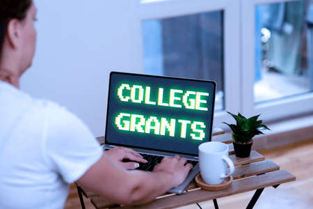 Hand writing sign College Grants. Business approach monetary gifts to showing who are pursuing higher education Online Jobs And Working Remotely Connecting People Togetherの写真素材