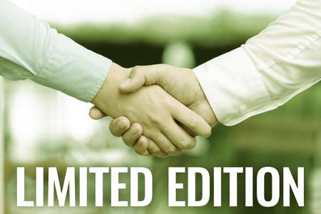 Inspiration showing sign Limited Edition. Word for Work of something which is only produced in small numbers Two Professional Well-Dressed Corporate Businessmen Handshake Indoorsの写真素材
