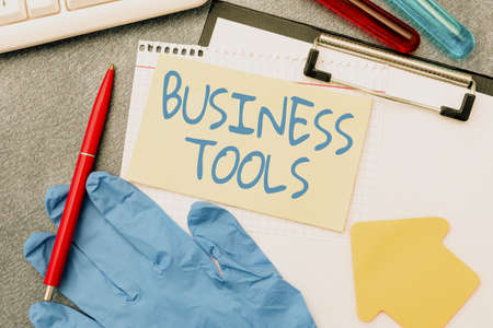Text sign showing Business Tools. Internet Concept Marketing Methodologies Processes and Technologies use Typing Medical Notes Scientific Studies And Treatment Plansの写真素材