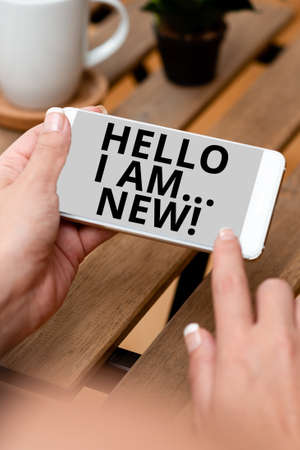 Hand writing sign Hello I Am New. Business overview used as greeting or to begin telephone conversation Voice And Video Calling Capabilities Connecting People Togetherの写真素材