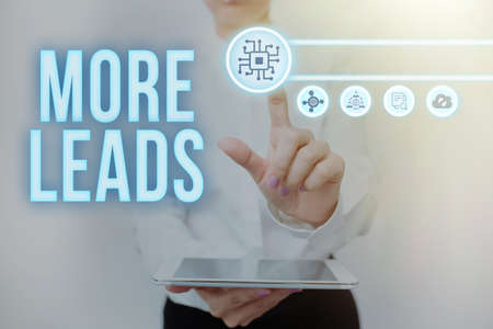 Text showing inspiration More Leads. Business overview initiation of consumer interest or enquiry into product Lady Holding Tablet Pressing On Virtual Button Showing Futuristic Tech.の写真素材