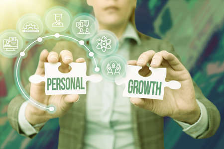 Conceptual display Personal Growth. Business idea improve develop your skills qualities Learn new materials Business Woman Holding Jigsaw Puzzle Piece Unlocking New Futuristic Tech.の写真素材