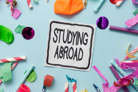 Text caption presenting Studying Abroad. Business approach learn outside of home in foreign country Travelling Colorful Party Collections Flashy Celebration Stuff Birthday Festival Kitの写真素材