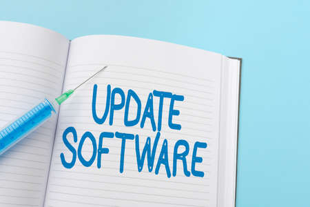 Writing displaying text Update Software. Business approach replacing program with a newer version of same product Writing Important Medical Notes Laboratory Testing Of New Virus Medicineの写真素材