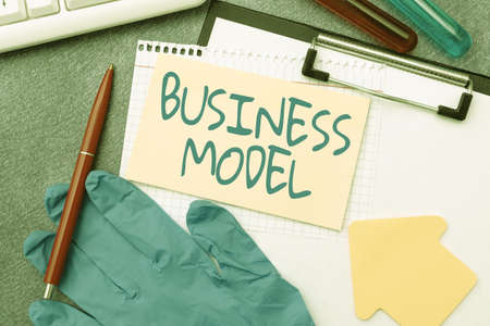 Handwriting text Business Model. Business overview Identifying revenue sources Plan on how to make profit Typing Medical Notes Scientific Studies And Treatment Plansの写真素材