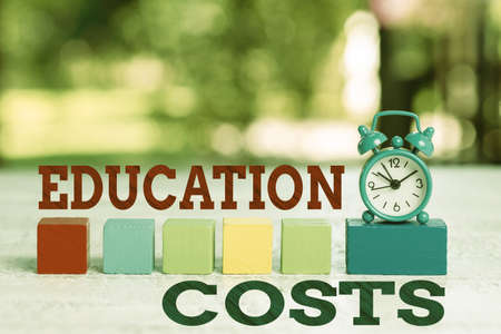 Writing displaying text Education Costs. Business idea amounts paid for tuition fees and other related expenses Working Activities Outside, Presenting Time Management Skillsの写真素材