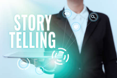 Text sign showing Story Telling. Business overview activity writing stories for publishing them to public Woman In Uniform Displaying Mobile Device Futuristic Virtual Tech.の写真素材