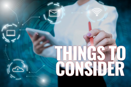 Writing displaying text Things To Consider. Business overview think about something carefully in order to make decision Lady In Uniform Holding Tablet In Hand Virtually Typing Futuristic Tech.の写真素材