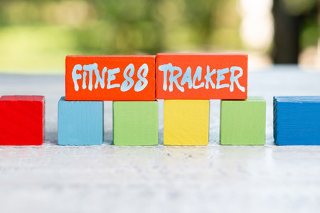 Conceptual display Fitness Tracker. Business showcase device that records a persons daily physical activity Working Activities Outside, Displaying Building Colorful Blocksの写真素材