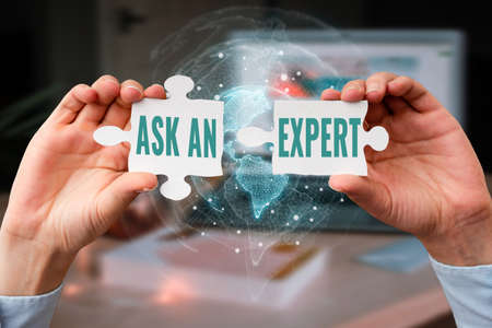 Text showing inspiration Ask An Expert. Internet Concept confirmation that have read understand and agree with guidelines Business Woman Holding Jigsaw Puzzle Piece Unlocking New Futuristic Tech.の写真素材