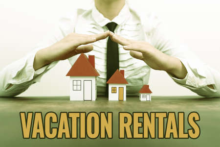 Inspiration showing sign Vacation Rentals. Business approach Renting out of apartment house condominium for a short stay New home insurances and coverages plans represeneted by ladyの写真素材