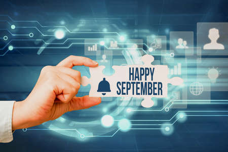 Conceptual caption Happy September. Business showcase welcoming the joy may bring of the ninth month of the year Hand Holding Jigsaw Puzzle Piece Unlocking New Futuristic Technologies.の写真素材