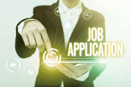 Text sign showing Job Application. Conceptual photo The standard business document serves a number of purposes Lady In Suit Pointing On Tablet Showing Futuristic Graphic Interface.の写真素材