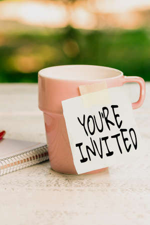 Writing displaying text You Re Invited. Conceptual photo make a polite friendly request to someone go somewhere Calming And Refreshing Environment, Garden Coffee Shop Ideasの写真素材
