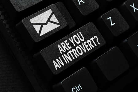 Hand writing sign Are You An Introvertquestion. Business approach person who tends to turn inward mentally Sending New Messages Online, Creating Visual Novels, Typing Short Storiesの写真素材