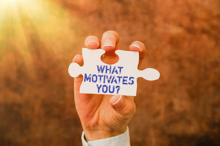 Hand writing sign What Motivates Youquestion. Concept meaning know reasons why you want to wake up each morning Businesswoman Find Strategy For Resolving Connecting Missing Ideas At Workの写真素材