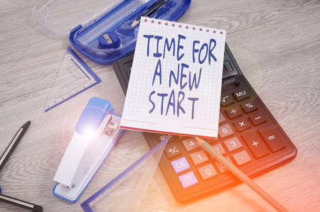 Conceptual caption Time For A New Start. Concept meaning something is supposed to begin right now Fresh job Blank Notebook Page With A Calculator And Geometric Stationery Over Table.の写真素材