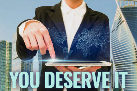 Handwriting text You Deserve It. Business overview should have it because of their qualities or actions Laptop Resting On Lap Of Woman With Flat Legs Accomplishing Remote Job.の写真素材