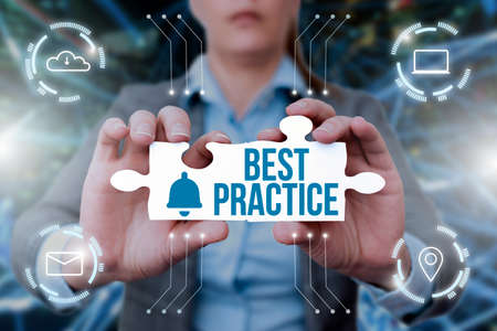 Sign displaying Best Practice. Business idea commercial procedures that are accepted prescribed being correct Business Woman Holding Jigsaw Puzzle Piece Unlocking New Futuristic Tech.の写真素材