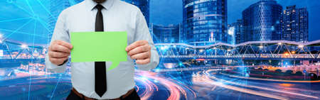 Businessman Holding Empty Page Chat Box With Both Hands Around Futuristic Technology. Employee...