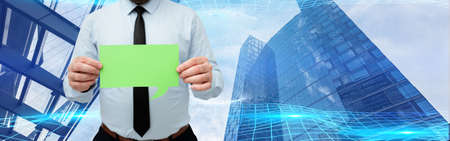 Businessman Holding Empty Page Chat Box With Both Hands Around Futuristic Technology. Employee...