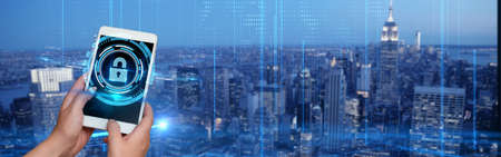 Picture Of Hand Holding Cellular Phone Pressing Main Button Presenting Futuristic Technology. Hand Using Digital Telephone Showing Modern Automation To The Public.の写真素材