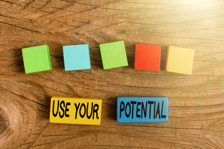 Text sign showing Use Your Potential. Business showcase achieve as much natural ability makes possible Stack of Sample Cube Rectangular Boxes On Surface Polished With Multi-Colourの写真素材