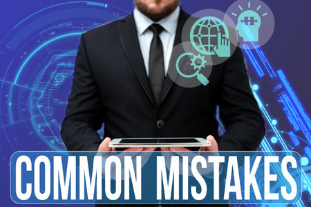 Sign displaying Common Mistakes. Business idea actions that are often used interchangeably with error Man In Office Uniform Holding Tablet Displaying New Modern Technology.の写真素材