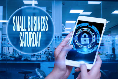 Hand writing sign Small Business Saturday. Concept meaning American shopping holiday held during the...