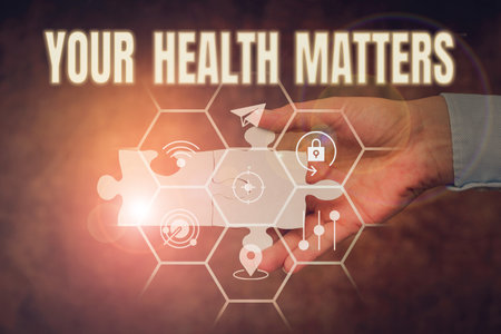 Inspiration showing sign Your Health Matters. Business idea good health is most important among other things Hand Holding Jigsaw Puzzle Piece Unlocking New Futuristic Technologies.の写真素材