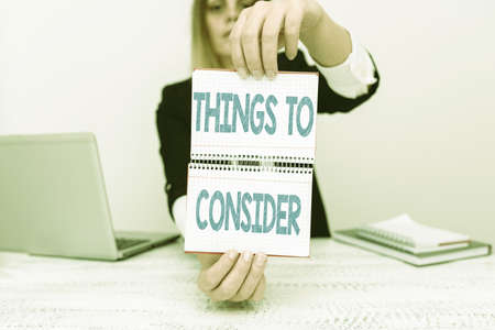 Hand writing sign Things To Consider. Word for think about carefully especially in making decisions Assistant Offering Instruction And Training Advice, Discussing New Jobの写真素材