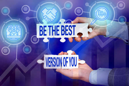Text caption presenting Be The Best Version Of You. Business showcase going to move away from where are start improving Hand Holding Jigsaw Puzzle Piece Unlocking New Futuristic Technologies.の写真素材