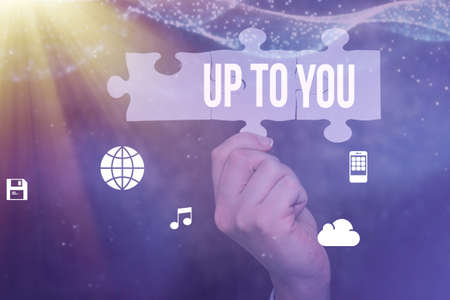 Sign displaying Up To You. Business concept it is used to indicate a decision or choices of an individual Hand Holding Jigsaw Puzzle Piece Unlocking New Futuristic Technologies.の写真素材