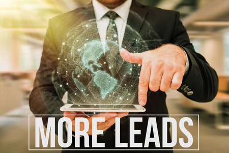 Text showing inspiration More Leads. Concept meaning initiation of consumer interest or enquiry into product Man In Uniform Standing Holding Tablet Typing Futuristic Technologies.の写真素材